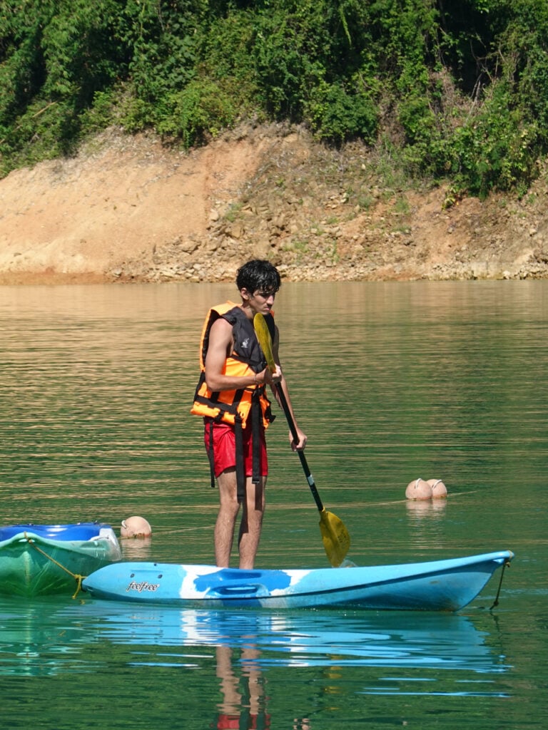 Participants paddle boarding