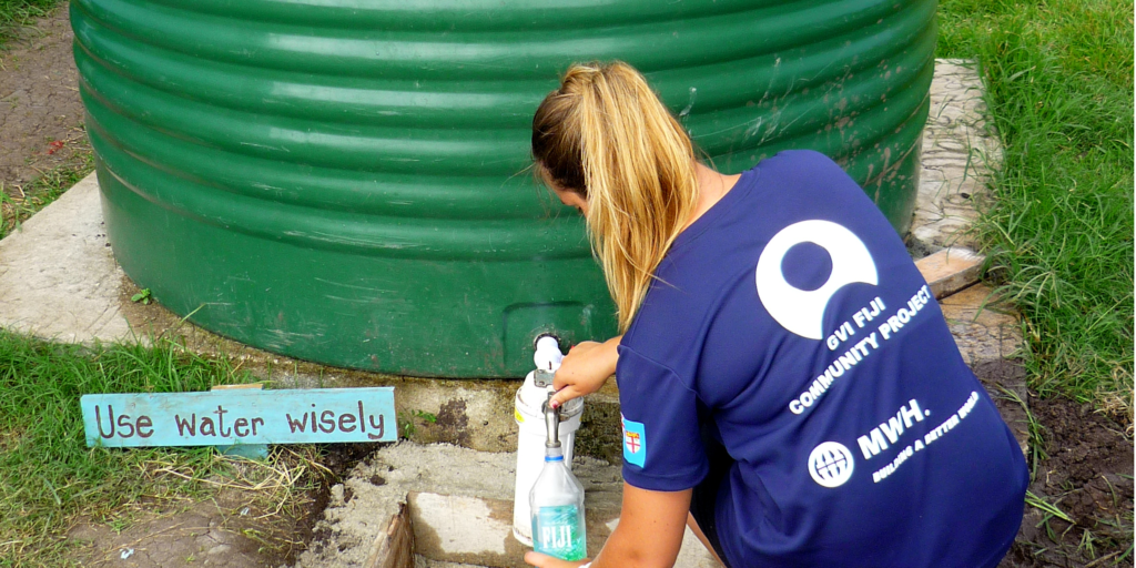 GVI participant using the water reserve tanks