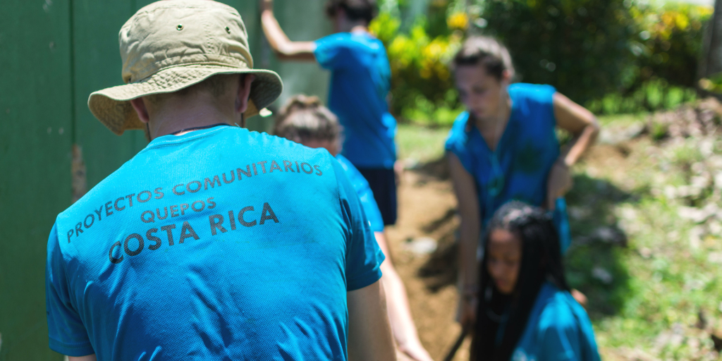 Participants working the land on the construction and community development program.