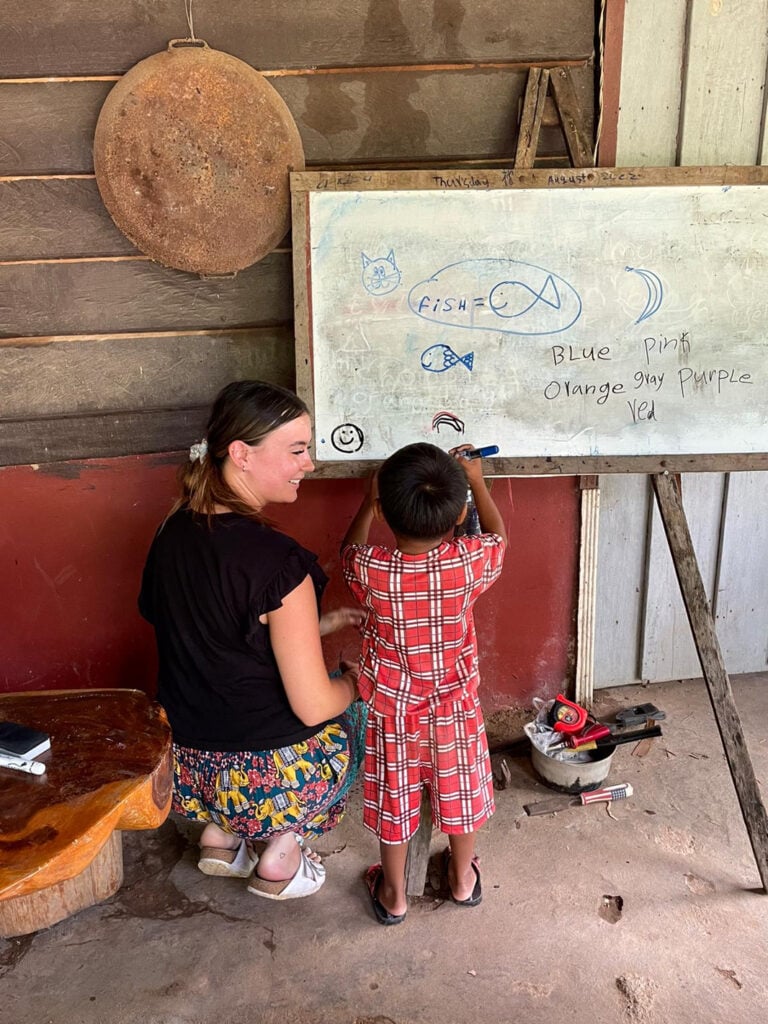 participant helping young student