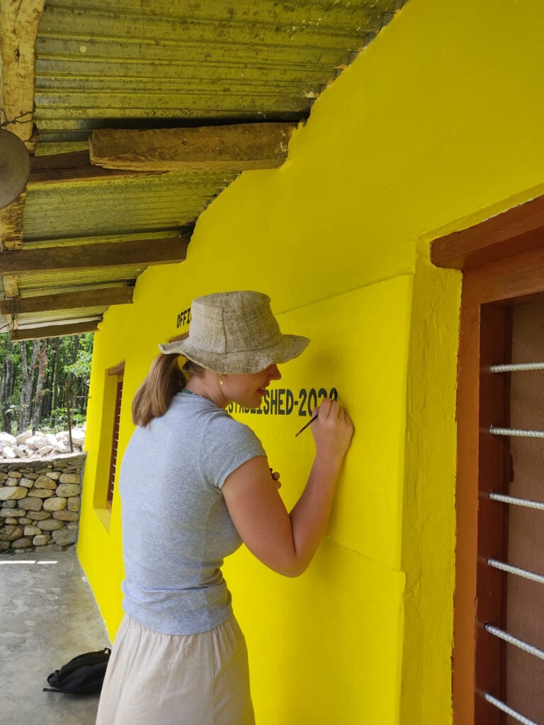 Painting a school with participants