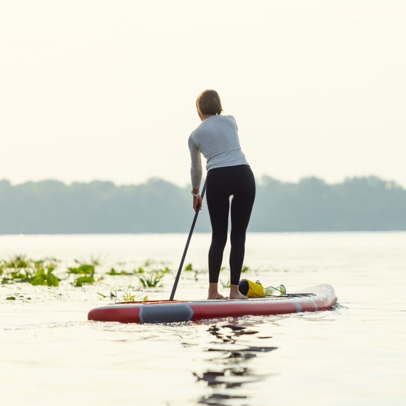 Stand-up paddleboard at sunrise