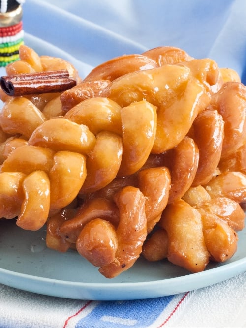 Golden koeksisters on a plate
