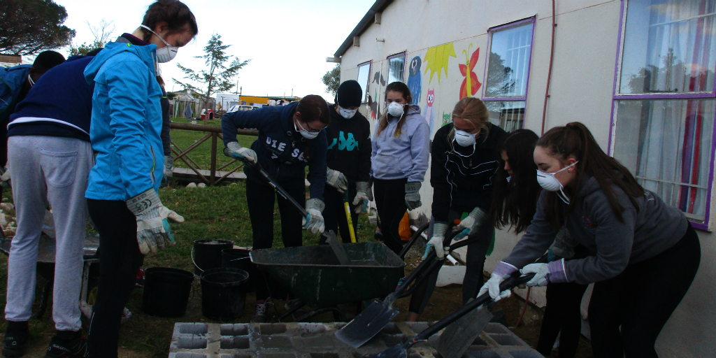 GVI under 18 volunteers busy with a community project. 