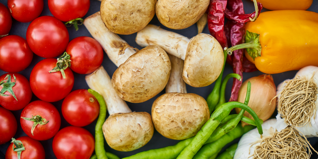 Vegetables lying on top of a tabletop.