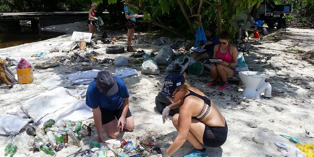 Volunteers taking part in a beach clean up in Curieuse, Seychelles.