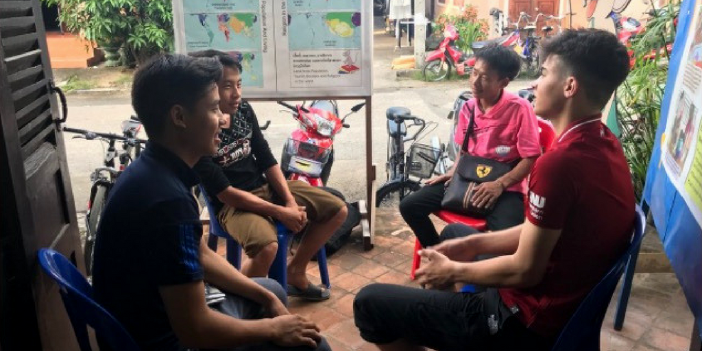 Students sitting with each other talking