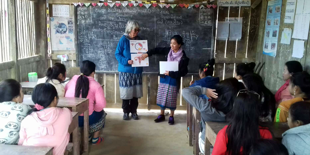 Women learn about health practises on a volunteer program. 