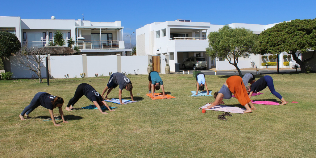 GVI volunteers doing yoga on base.