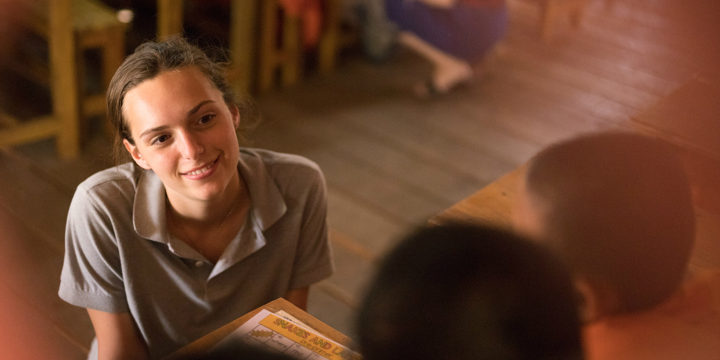 A GVI teaching participant listens to one of the novice monk students in her classroom. Organisation, confidence, language and cross-communication skills are a few of the benefits to this gap semester program.