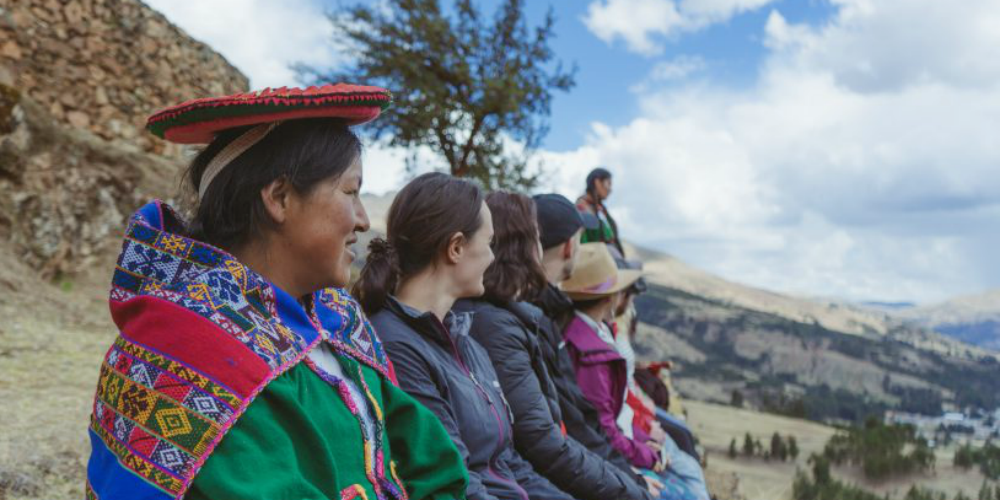 Participants enjoy a view of the Sacred Valley in Peru . Experiences like this is one of the many pros of taking a career break.