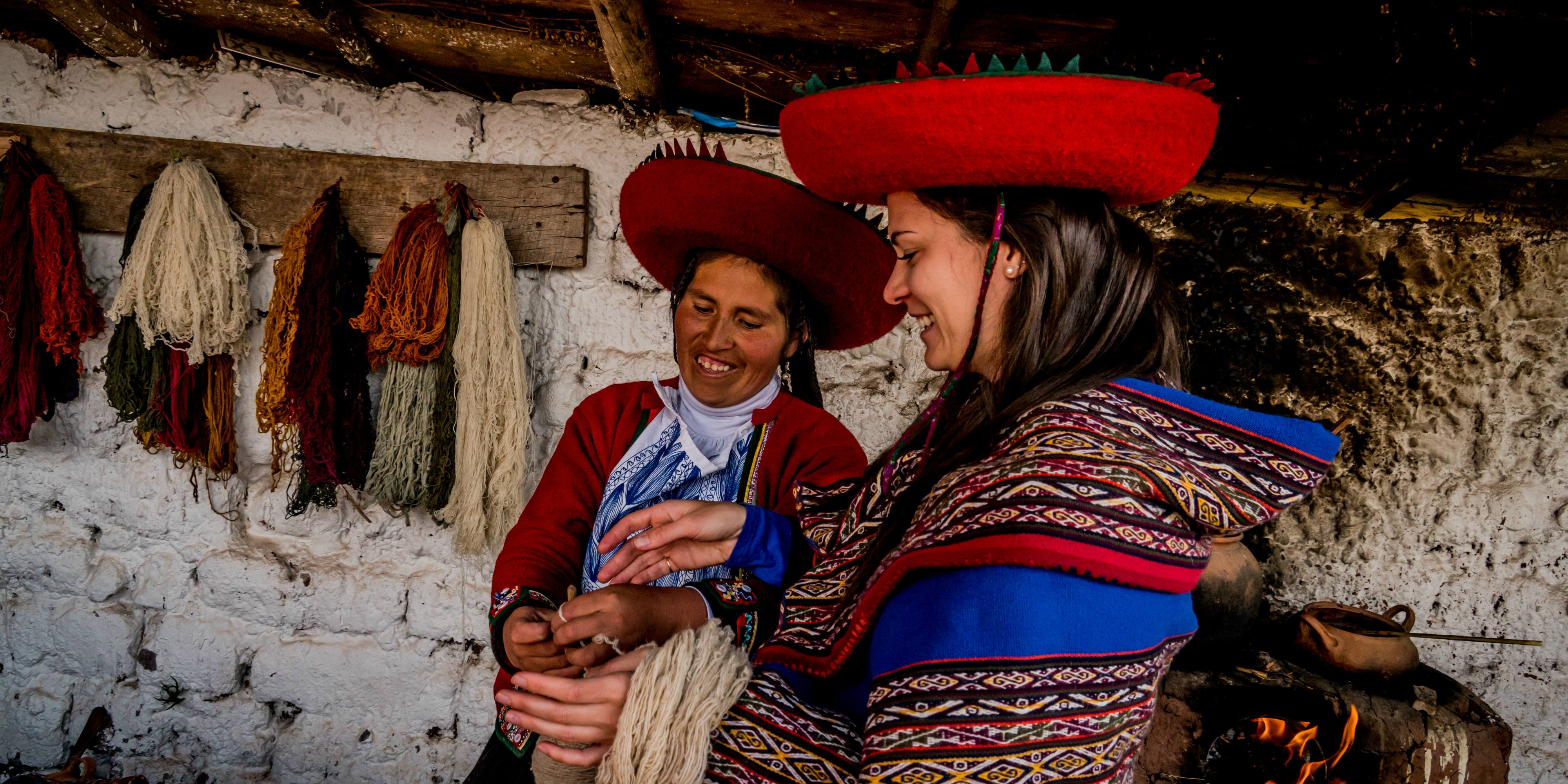 A GVI participant learns about dying wool in Cusco, Peru. As part of community development internships abroad, participants help facilitate business and skills development workshops. 