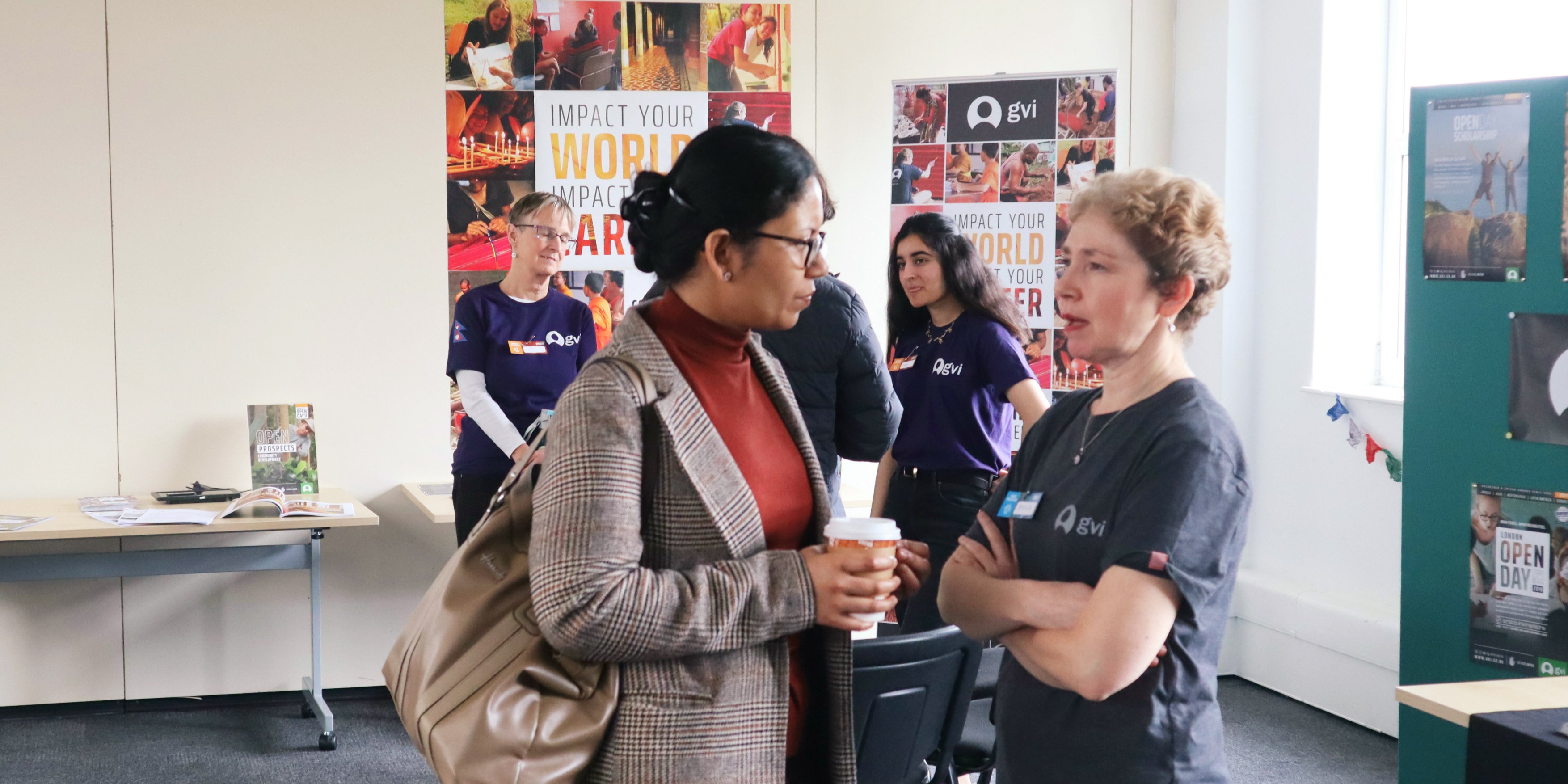 GVI ambassadors discuss GVI projects at an Open Day event in London. GVI's teen volunteering opportunities are a great way for teens to begin making an impact.