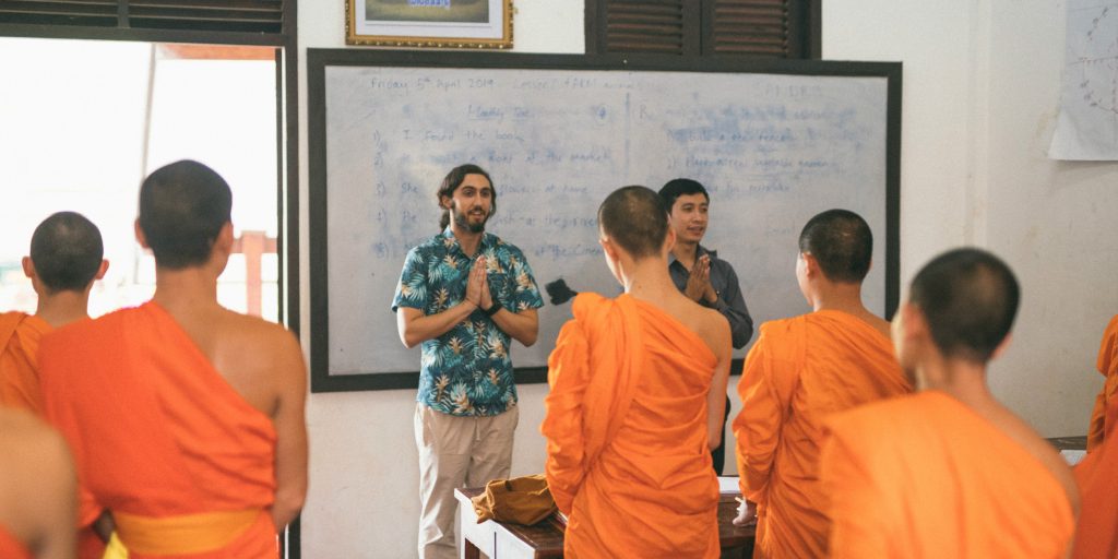Teach novice Buddhist monks in Laos