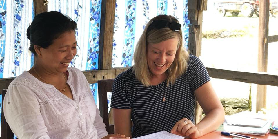 A GVI participant works on English language skills with a community member. These kinds of skills development programs are some of the best volunteer abroad programs for adults.