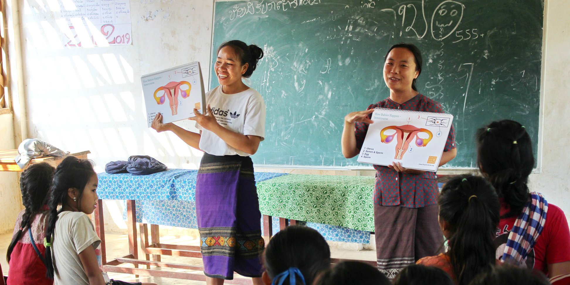 GVI-trained local leaders deliver a menstrual health workshop in Laos, as part of women's empowerment work.