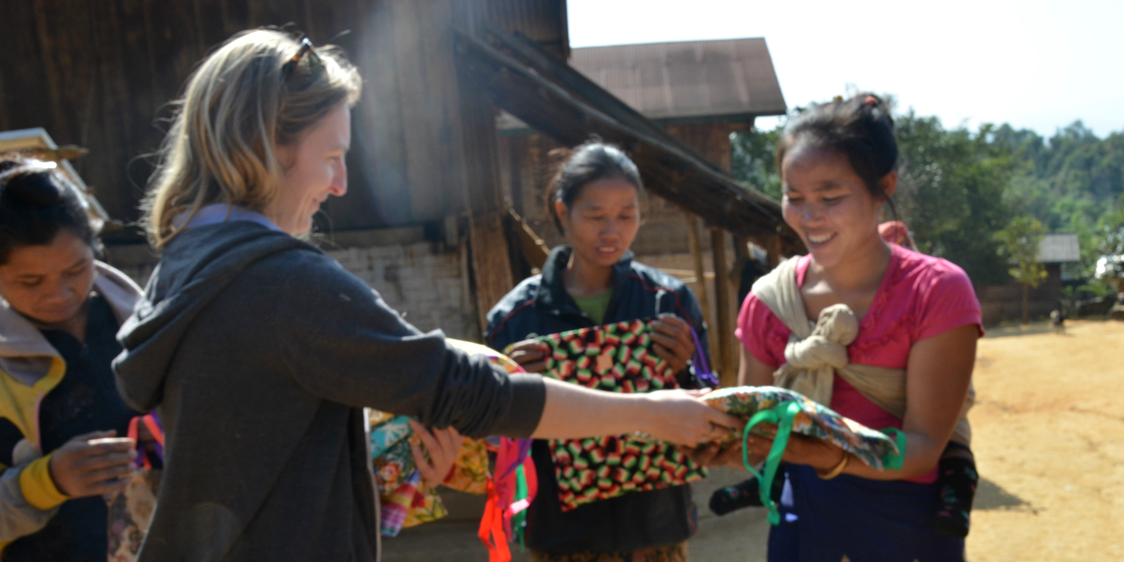 A GVI participant helps disseminate Days for Girls menstrual health kit at a menstrual health workshop.