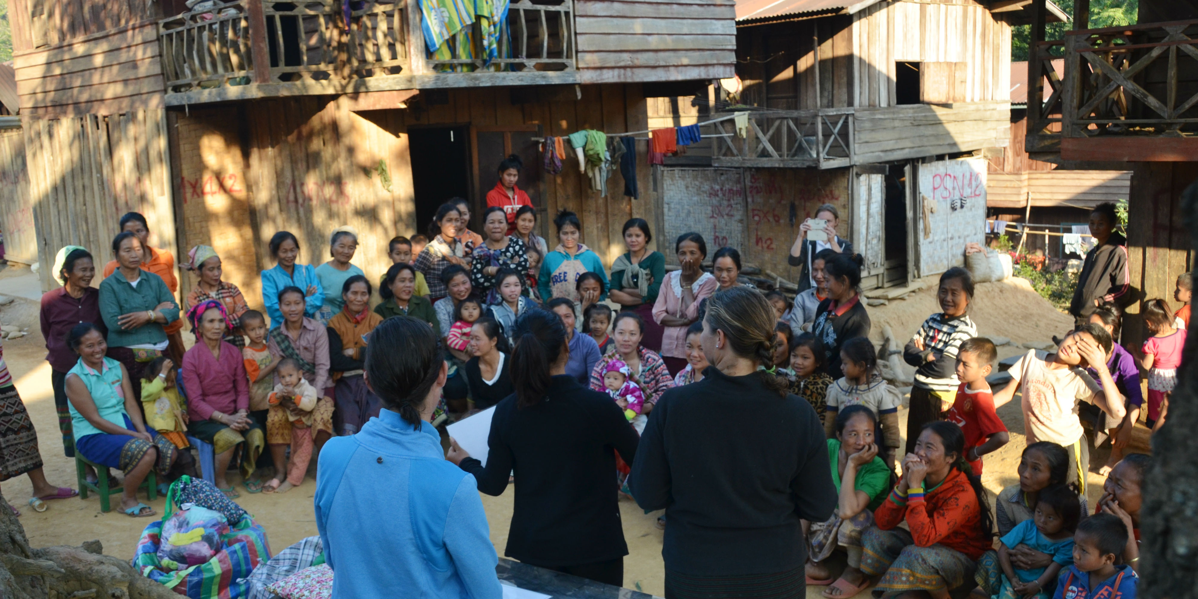 GVI participants help Laos women learn about menstration through a women's empowerment project.