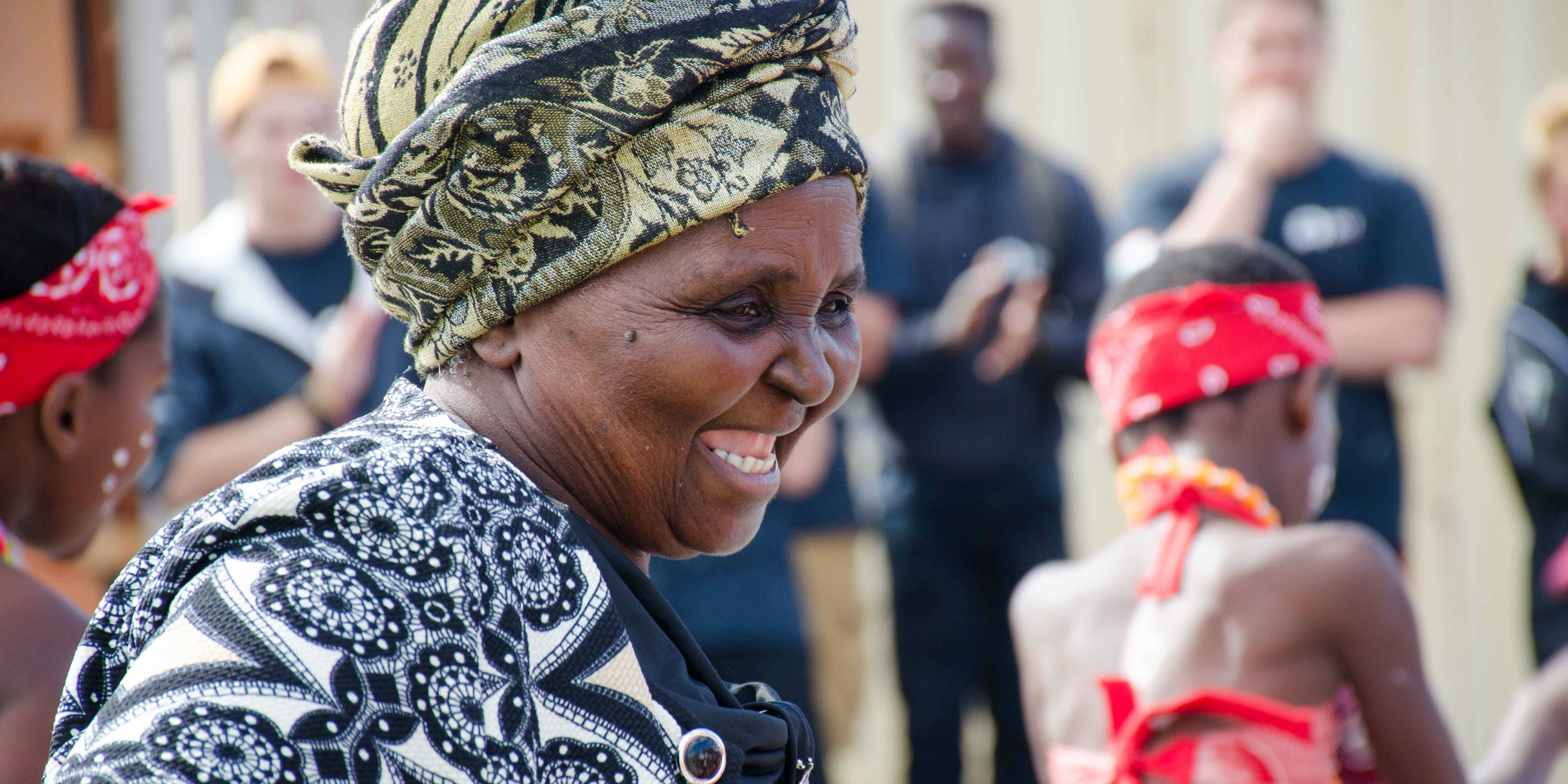 A women celebrates in Cape Town, South Africa. As a volunteer in South Africa, you will work with local women on activities for women's empowerment.