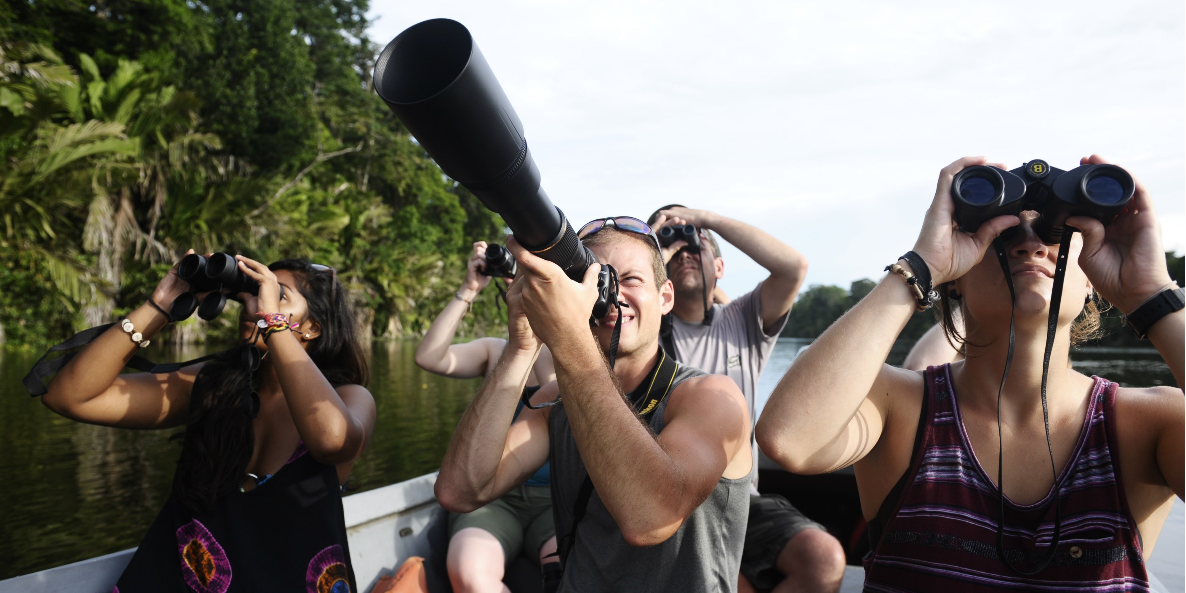 Wildlife conservation volunteers take a boat ride in Jalova, and try to spot their favourite species.