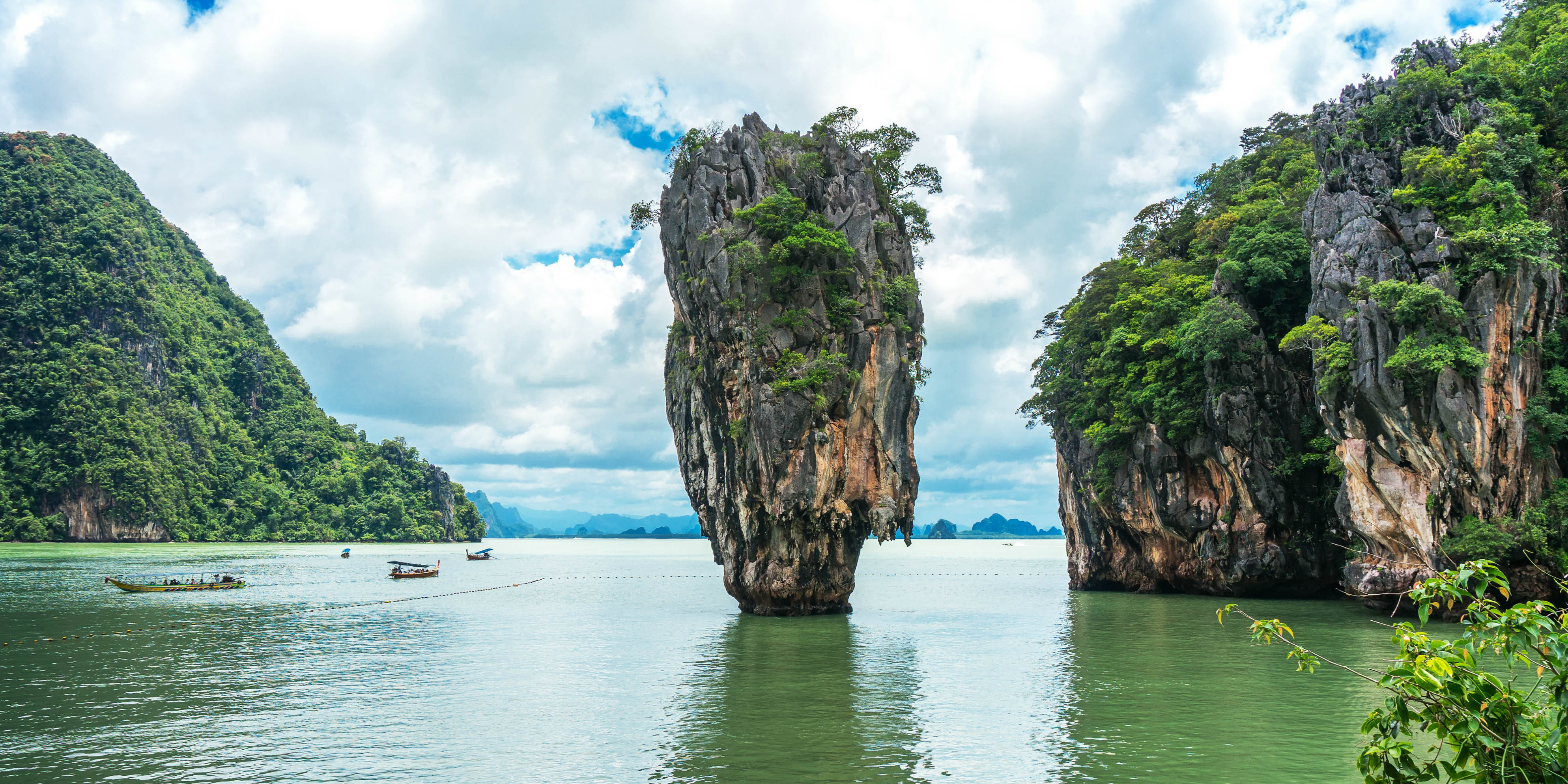 Boat trips around Phang Nga bay, Thailand, include amazing views and the James Bond Island shown here. 