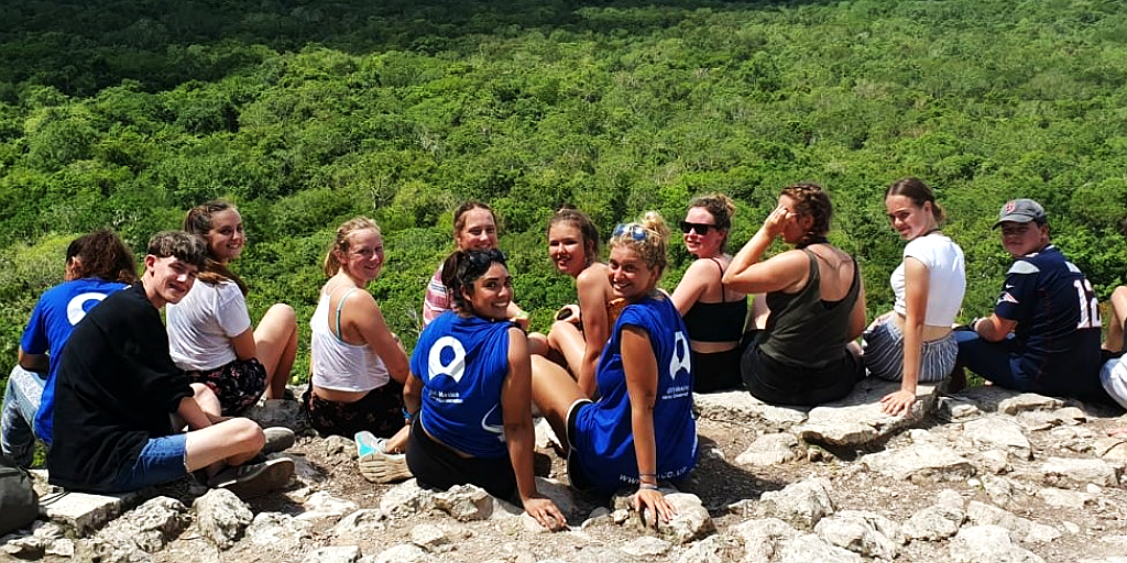 GVI volunteers on top of the Coba pyramid