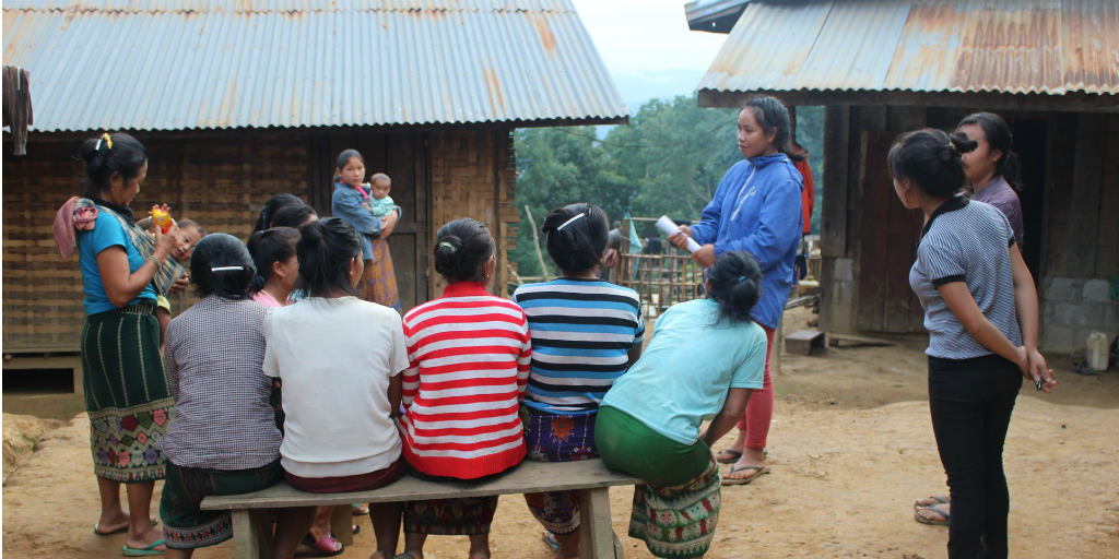 volunteers doing health education with local women