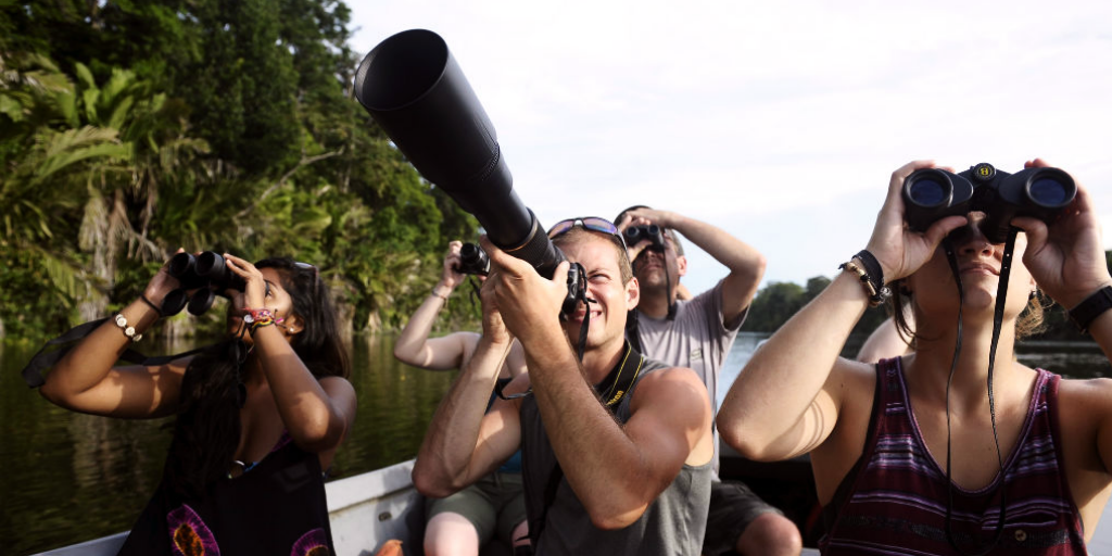 Participants doing river rafting and watching the wildlife of Costa Rica