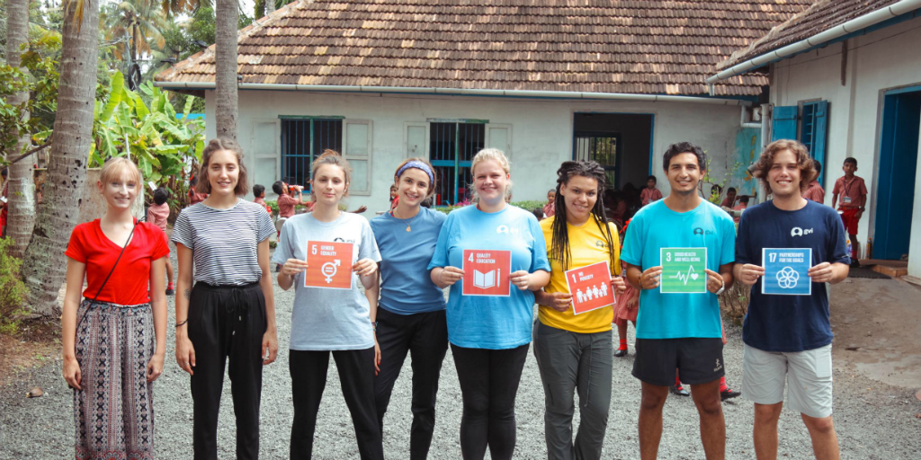 Volunteers holding up some of the UN SDGs in kerala