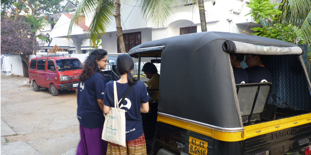 volunteers getting into a tuk-tuk in India