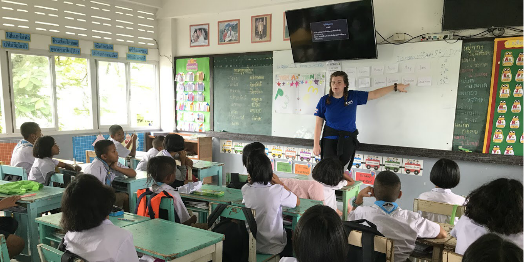 A volunteer teaching a class of children in Phang Nga, Thailand.