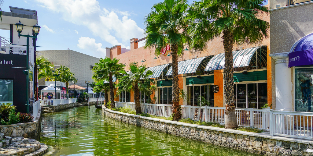 Shops surrounding a canal in Cancun