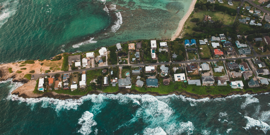 An aerial photo of houses on the coast.