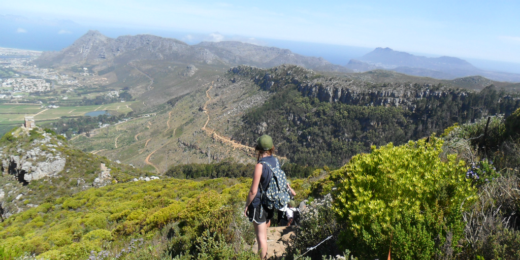 A GVI volunteer looking out over the landscape from a mountainside in Cape Town, South Africa.