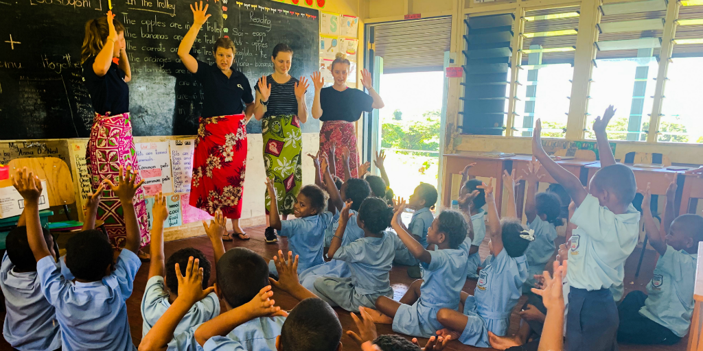 Volunteers teaching a class of children in Dawasmu.