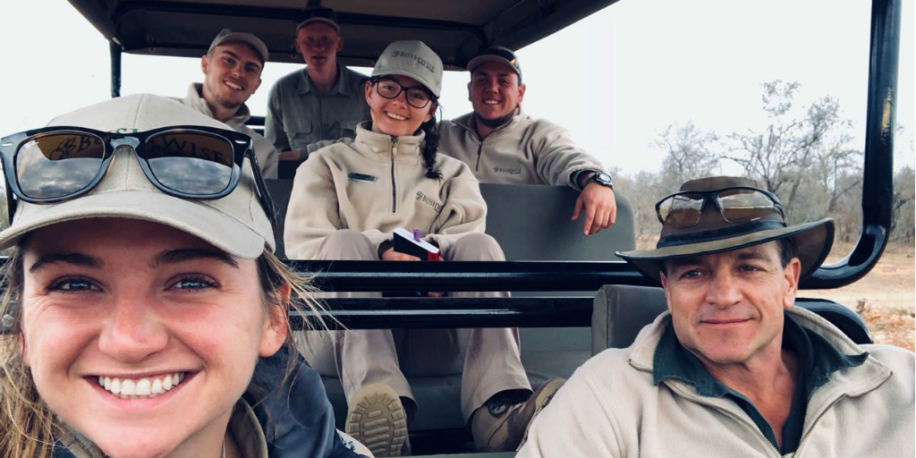 Volunteers in a safari vehicle with a Bushwise staff member.