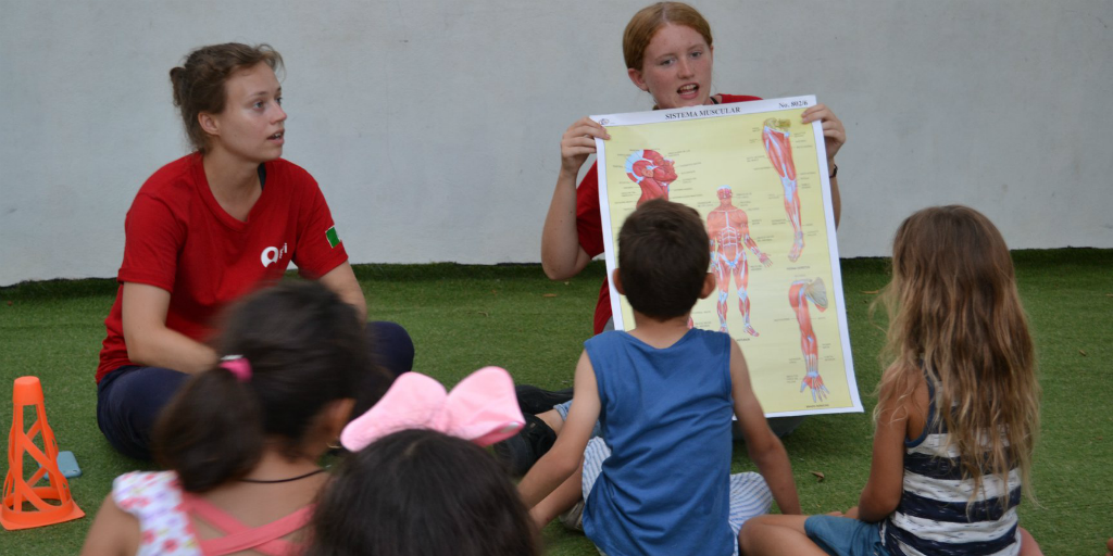 Volunteers teaching good public health practices and preventative healthcare