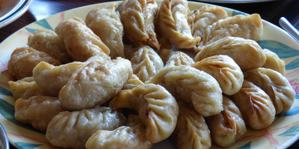 Taste a local dish in Pokhara when you volunteer in Nepal.