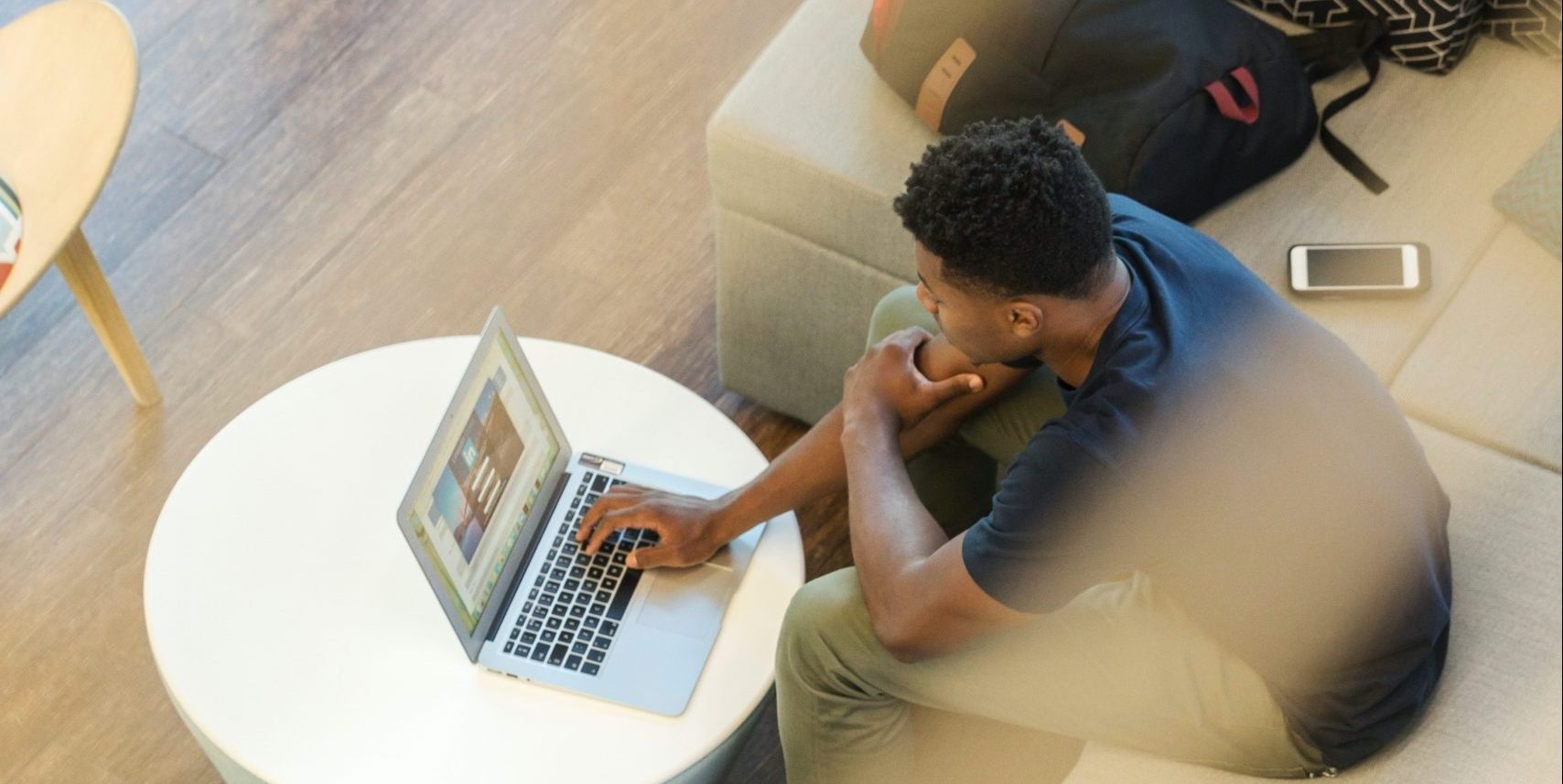 A man works on his laptop and learns about sea turtle conservation