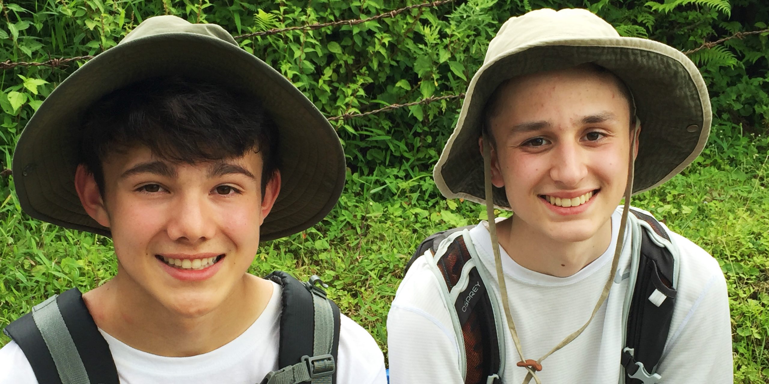 Two teenage volunteers rest during a hike in Pokhara, Nepal