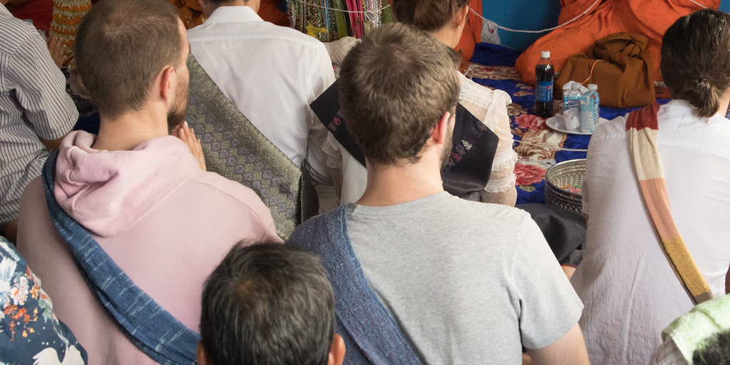 Participants wearing fabric over their shoulder