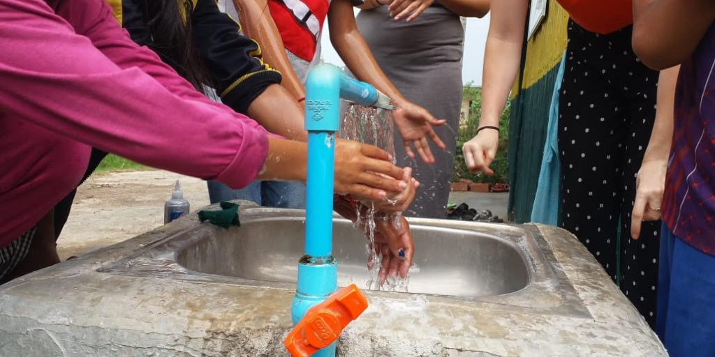 GVI volunteers and local community members practicing good hygiene measures