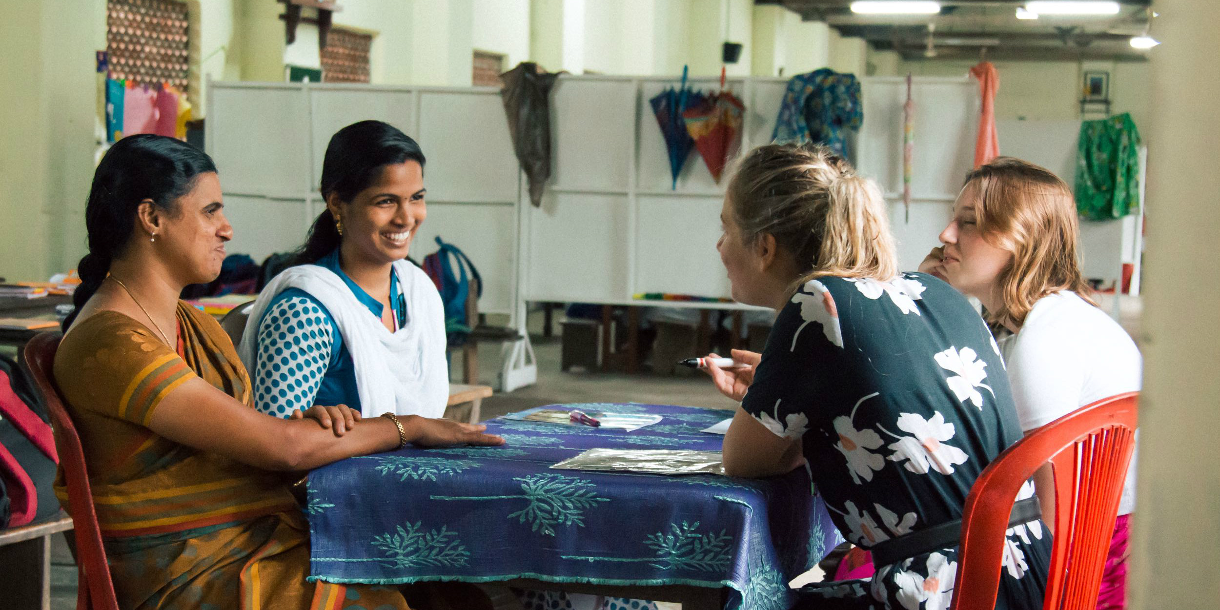 Women work through educational content as part of women empowerment in India efforts. 