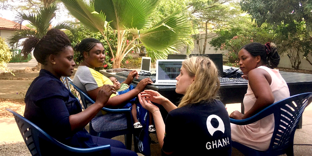 A lady teaches other women the importance of health during a public health internship.