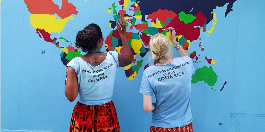 The volunteers of GVI enhance their painting skills by painting a world map on the wall. 
