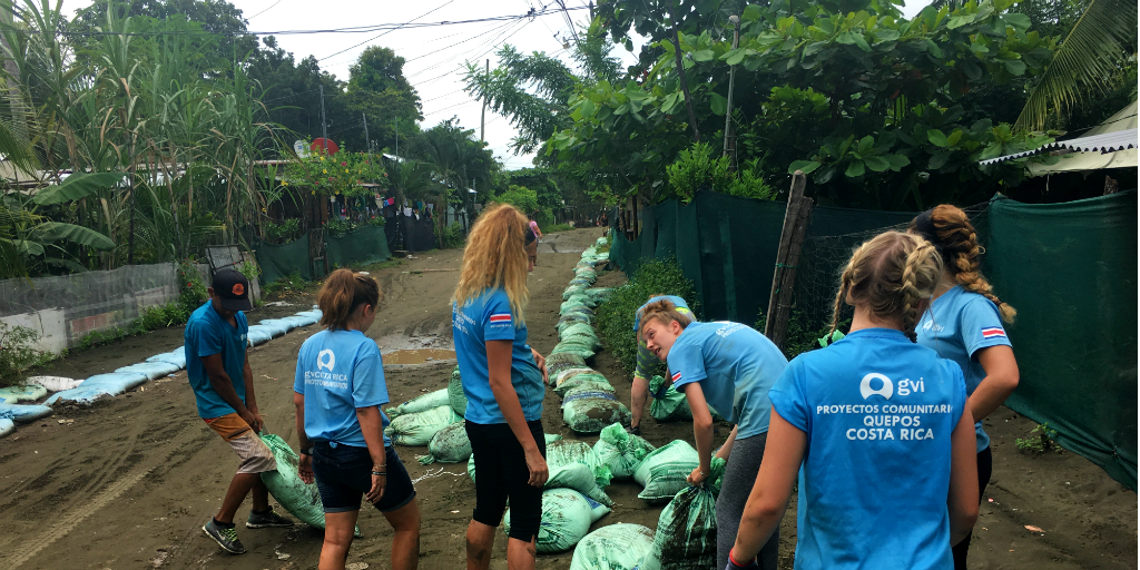 The participants practice their Spanish while busy with a community project on a summer language immersion program. 