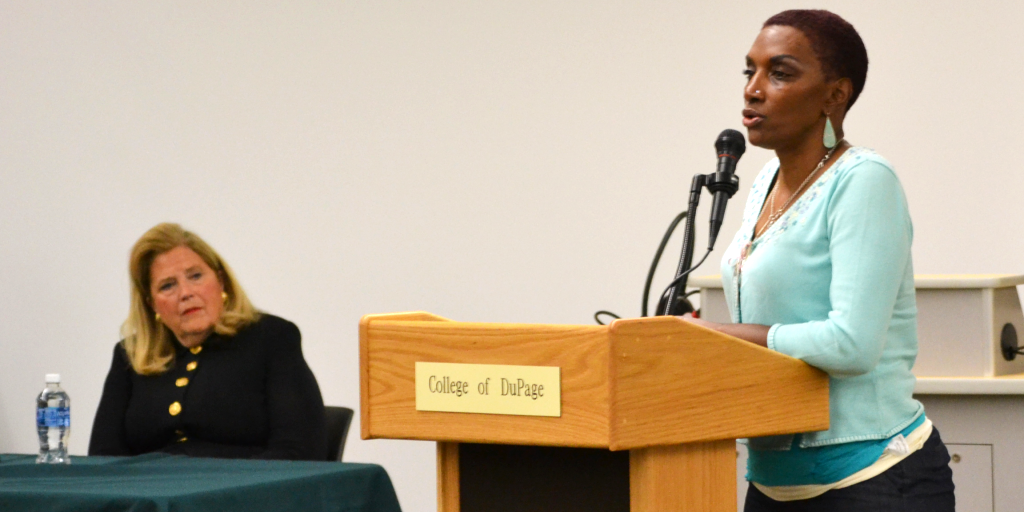 A woman speaks at a human trafficking talk. 