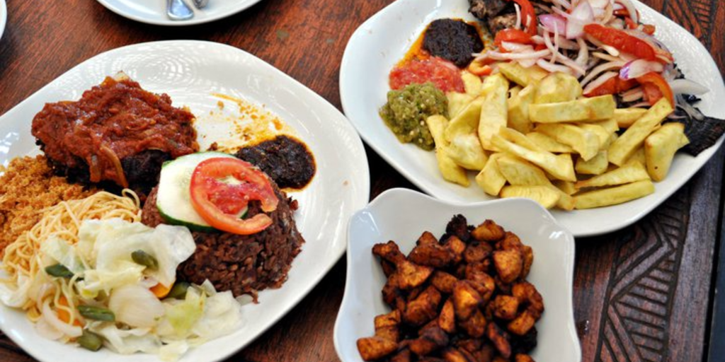 A plate full of different Ghanaian food. 