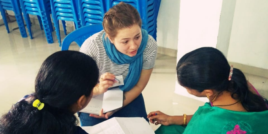 Volunteer and local women working together on a project that may help bring extra income. 