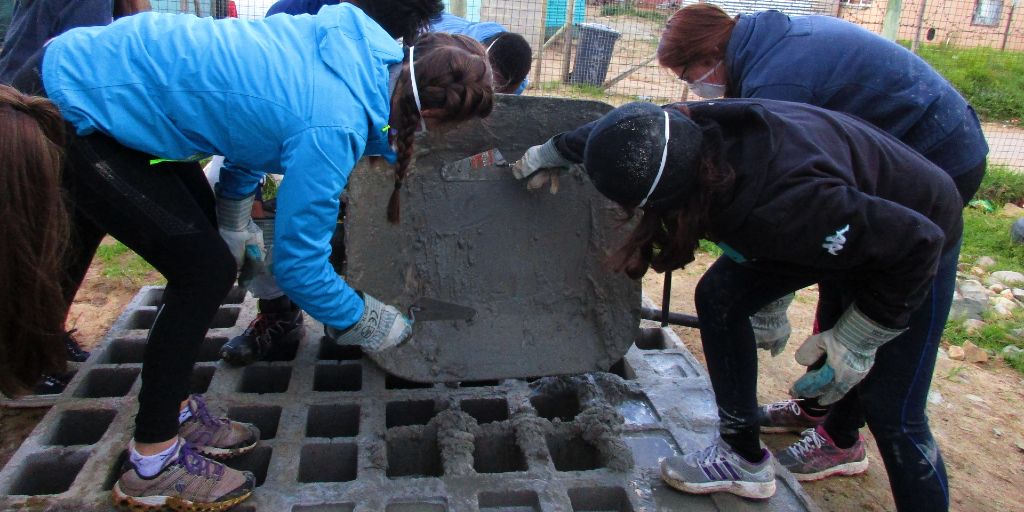 GVI's Cape Town based volunteers contribute to the sustainable community development by building a water tank stand. 